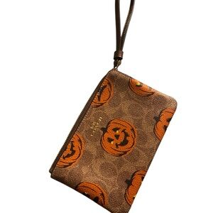 Coach Halloween print, Limited Edition Pumpkin Wristlet. NWT, sold out